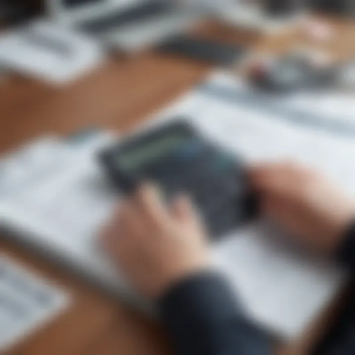 A person reviewing financial documents with a calculator